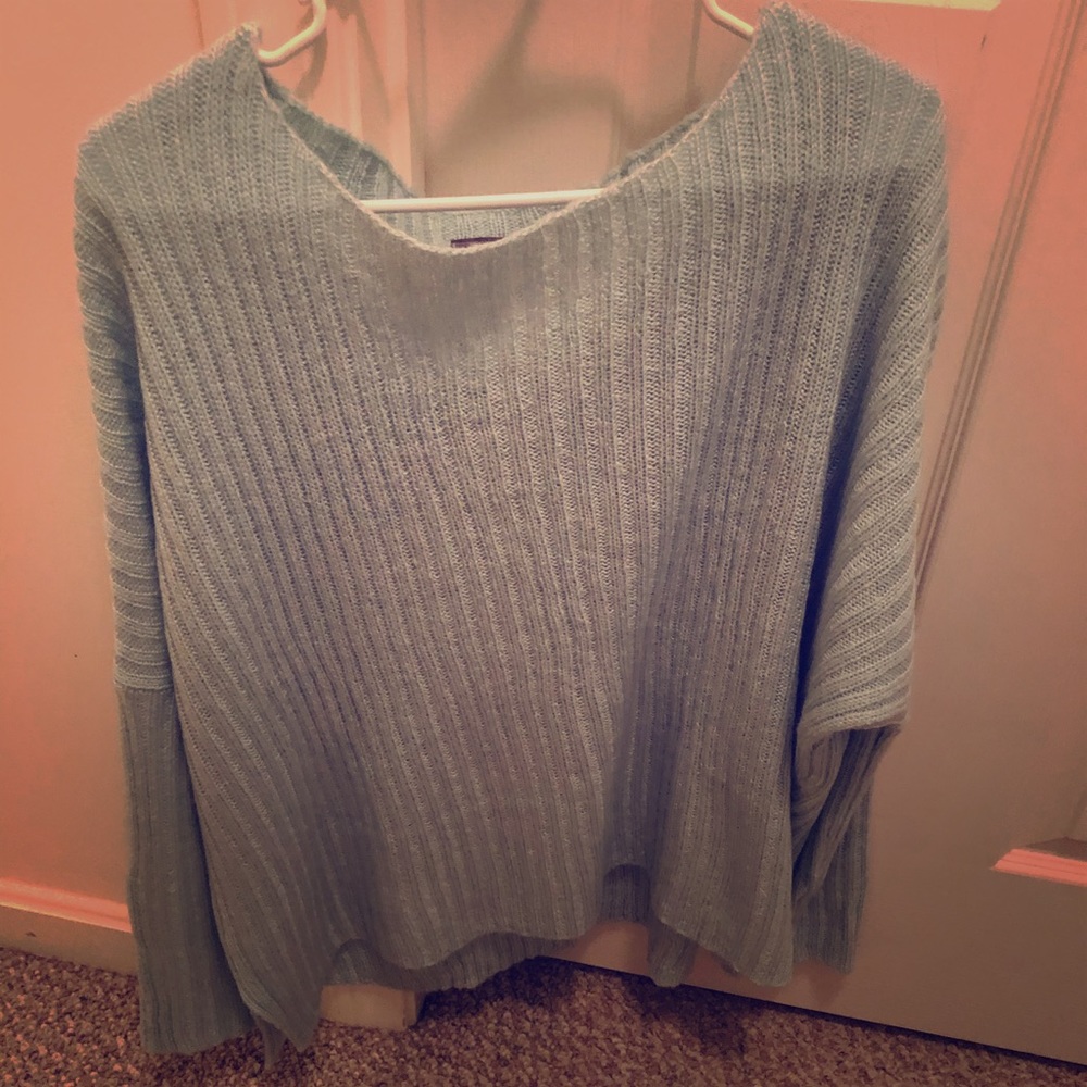 Slouchy sweater. Wooden ship